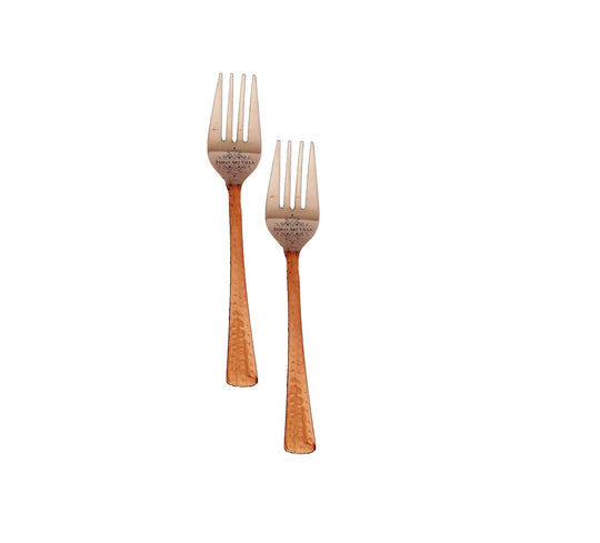 Set of steel copper hammered forks with sleek tines and decorative handles for luxury dining by IAV.
