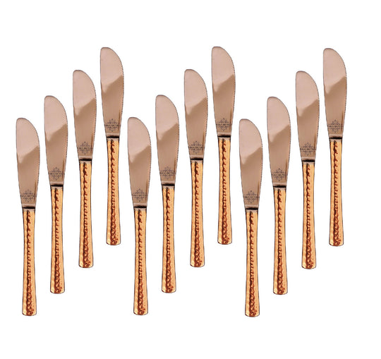 Indian Art Villa's 12 piece butter spreader set with hammered copper handles and stainless steel blades for a chic table.