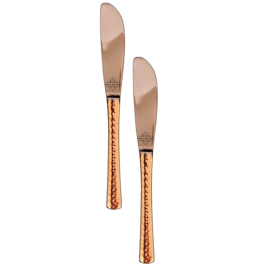Copper butter spoons set with unique hammered copper handles and smooth stainless steel blades for a luxurious touch.