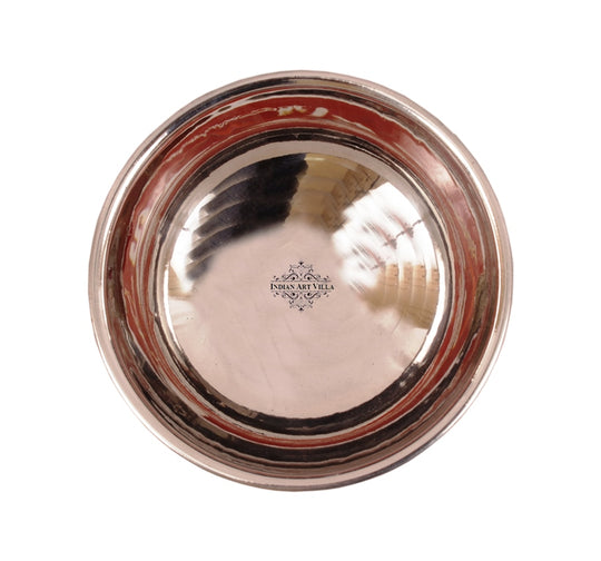 Polished copper ice cream bowl with a brass stand a luxurious design perfect for showcasing sweet confections.