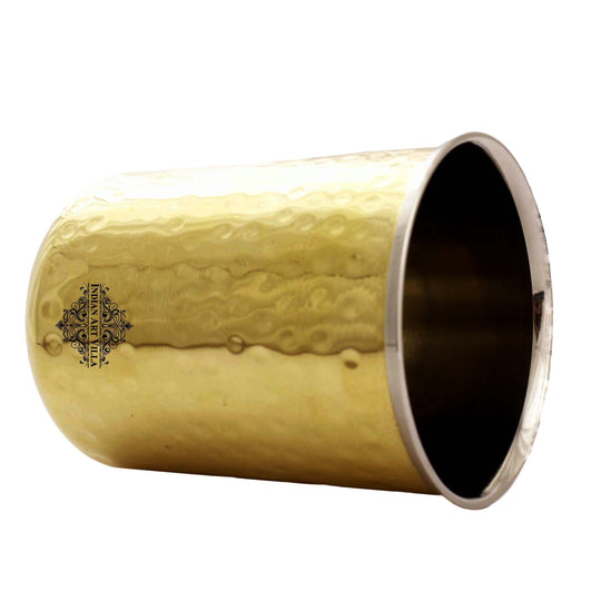 Elegant hammered brass glass with a pure steel lining perfect for serving your favorite drinks in an artistic way