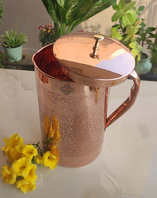 Decorative 1000ml copper jug with rich embossed design and brass lid, serveware by Indian Art Villa