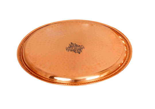 Indian Art Villa hammered copper thali ideal for traditional celebrations and offering delicious meals.