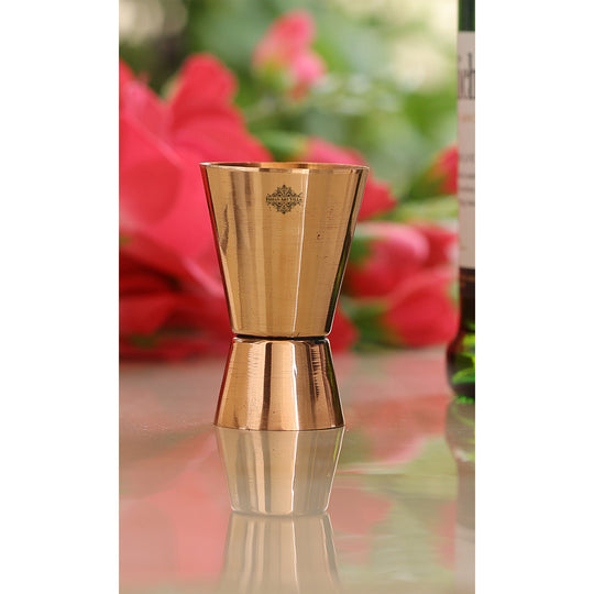 Indian Art Villa pure copper jigger shot glass with dual-sided design, handcrafted barware for cocktails, whiskey, and mixology.