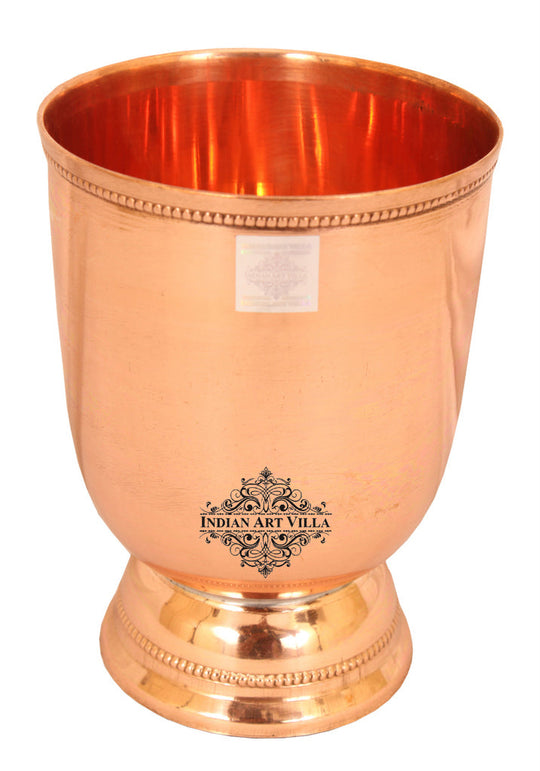 Stylish and elegant copper tumbler with a smooth surface and detailed beaded base, ideal for high-end serving.