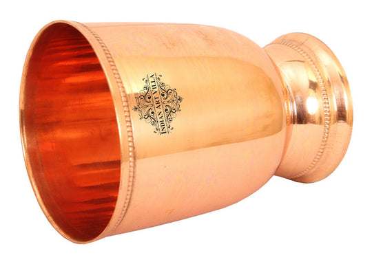 Premium copper tumbler with smooth finish and decorative base, ideal for luxury dining and special occasions.
