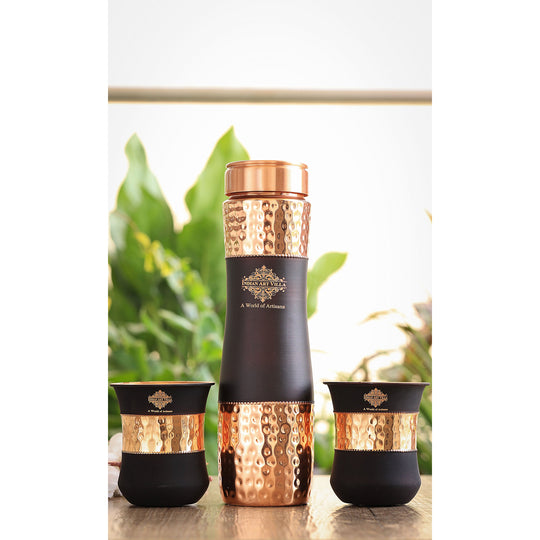 Exquisite copper drinkware set by Indian Art Villa with a hammered texture and black silk finish, perfect for gifting.
